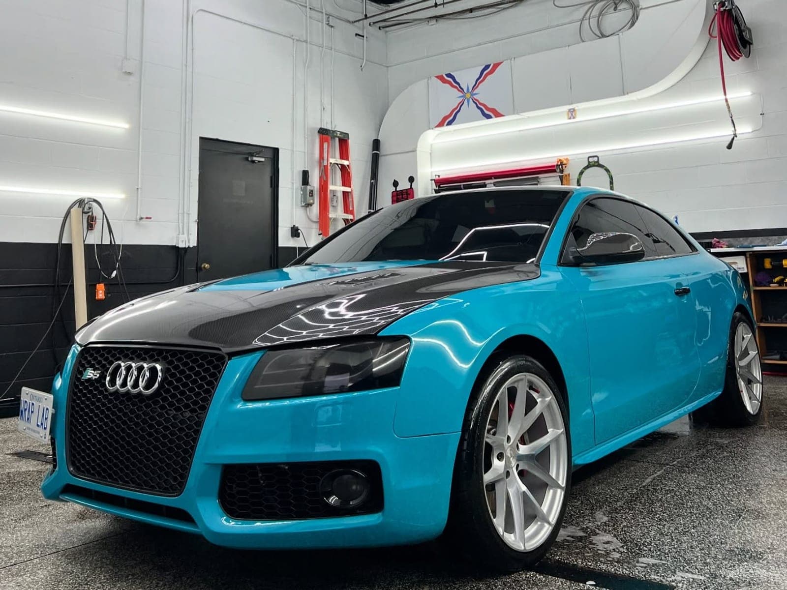 Audi S5 in high gloss Miami blue with a carbon hood
