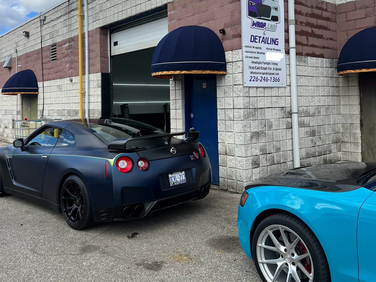 Satin black Nissan GT-R outside the WrapLab shop