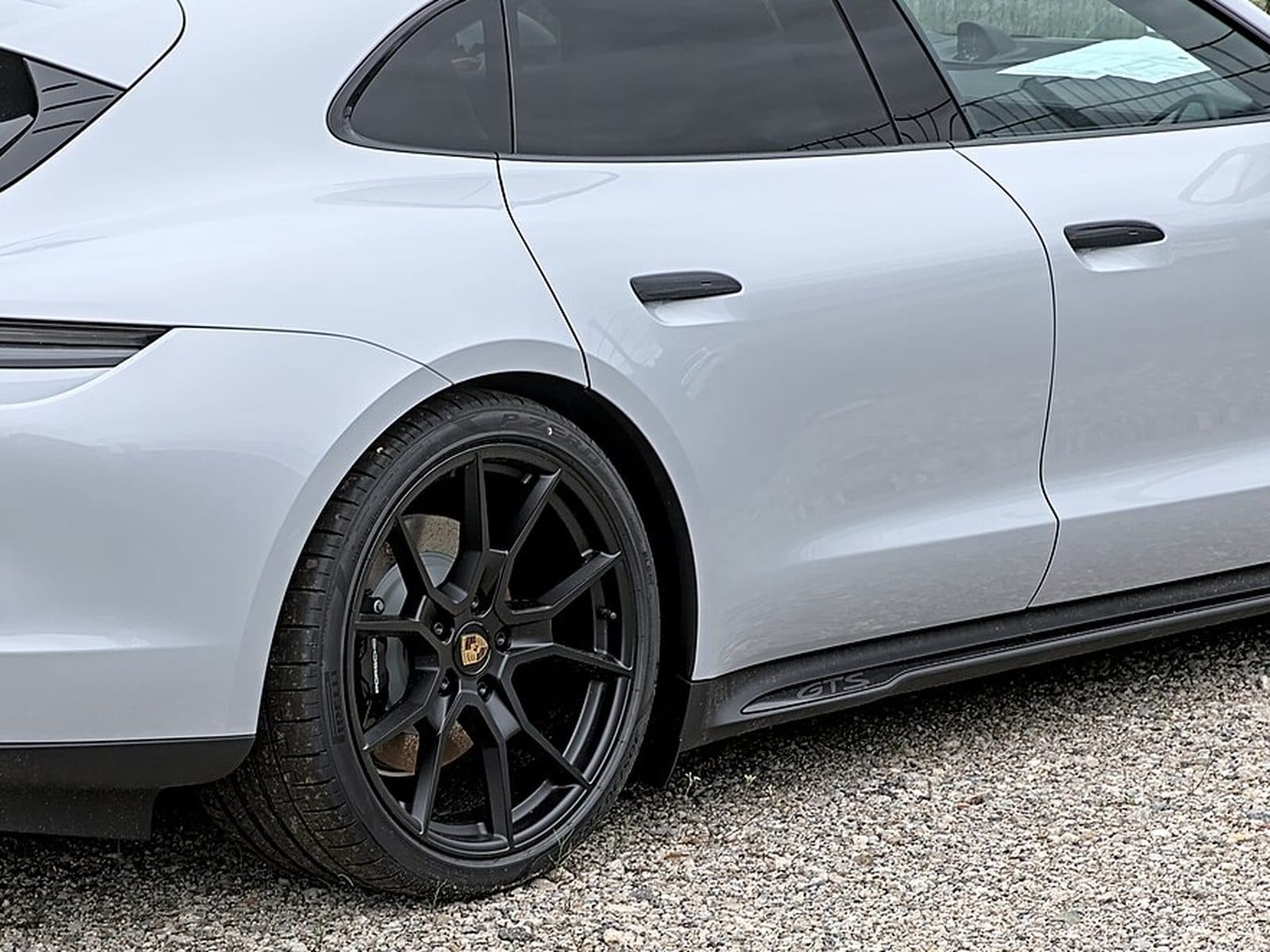 White Porsche Taycan with gloss black trim