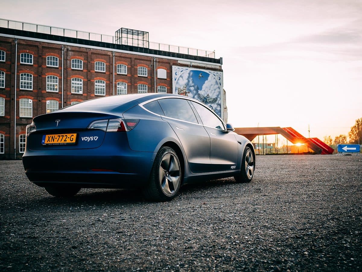 Wrapped company car with branding at sunset